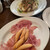 リゾットカレースタンダード - 料理写真:お通し(手前)とお肉がのったポテトサラダ(奥)