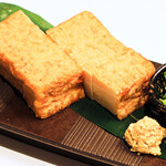 Deep-fried tofu grilled on a charcoal grill