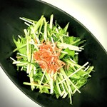 Pea sprouts and mizuna topped with sakura shrimp, ario-olio