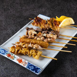 Yakitori (grilled chicken skewers) with a focus on everything.