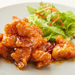 餃子伝説総本舗 - 料理写真:鳥の唐揚げ特製四川辛ソースかけ