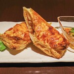 Grilled pork wrapped in green onion miso pie served with spicy chili oil sauce
