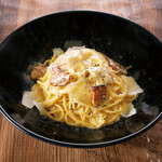 Rich and luxurious carbonara with Parmesan and Iberian pork