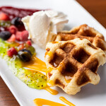 Waffles with cream cheese and fruit sauce