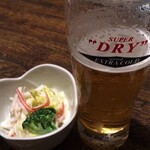 町の居酒屋　西菜 - "お通し＆アサヒスーパードライエクストラコールド"