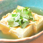 Dashi rolled egg floating in soup stock