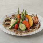 Grilled colorful vegetables with black garlic sauce