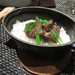 レストラン バカール - 牛ほほ肉と九条葱の鉄鍋ご飯、ポルチーニのスープで  パルミジャーノチーズとファイブペッパーソルトをお好みで1