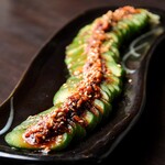 A cucumber with chili oil to eat