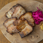 Homemade smoked pork belly grilled
