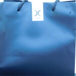 西麻布 焼肉 X - お土産のカレーパンが入った手さげ袋