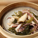 Squid steamed with mustard greens