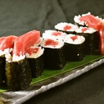 Bluefin tuna tekka roll that sticks out