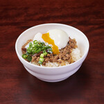 Rice topped with minced meat and warm egg