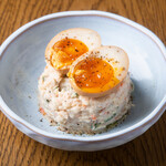 Oshioi potato salad topped with flavored egg