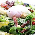 Caesar salad with warm egg