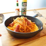 Fresh pasta Neapolitan on an iron plate