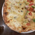 石窯イタリアン チーナ邸 - 料理写真:ハーフ&ハーフピザ　左が4種チーズ　右がCAT（チキン、アボカド、トマト）めっちゃ熱々で美味い！！
