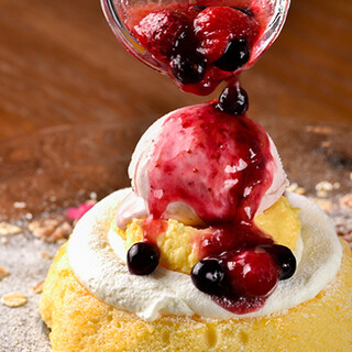 Enjoy a luxurious dessert plate with pudding, ice cream, and sauce.