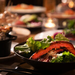 Caesar salad with thick-sliced bacon, kale, and romaine