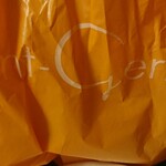 Sanjeruman - 商品の袋。
                        店舗のロゴが白文字で大きく書かれております。