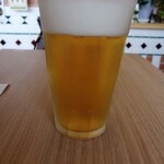 Cafe & Dining FERMATA - Sipping beer while waiting for the hot dog to be served