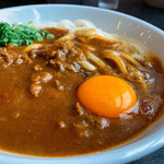 得得うどん - ジャワ風カレーうどん生卵トッピング