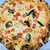 ラ トラットリア エストルト - 料理写真:トマトとバジルのピザ！これうまい！テイクアウト