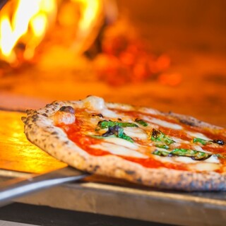 Authentic pizza baked in a wood-fired oven by a pizza chef!