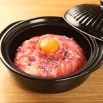 Marbled Matsusaka beef cooked in a clay pot with rice Sukiyaki