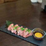 Thinly sliced beef tongue with egg yolk sauce