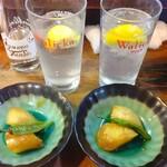 もつ焼 まるい - お通し（ジャガイモの甘煮）