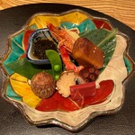 もちづき - 八寸〜海老の旨煮、秋田いぶりがっこ、タコ柔らか煮、生麩、滋賀県赤蒟蒻、衣被、岩もずく、スナップエンドウ、ハリハリ