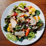 Caesar salad with plenty of seasonal vegetables and warm eggs