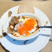 La Brianza - トリュフグラタンピエモンテ風秋トリュフ。混ぜ混ぜ。田中農園の健康玉子は味わいも黄身色も濃いの、チーズソースとチーズもいい感じ♪もちろんトリュフもね(๑´ڡ`๑)