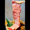 Taishouyakinikuhorumonketsupurasu - 料理写真:名物の和牛骨付き王様カルビ