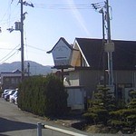 Nuveru terowaru - バイパスから見える看板、後ろがお店