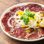 Raw lamb carpaccio