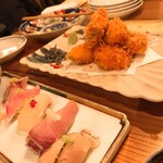 晩酌と晩御飯 ちょうつがひ - 名物の鱈フライは塩昆布を乗せて。