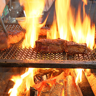 Enjoy Steak aged for 40 days and grilled over wood and charcoal.