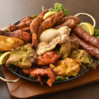 We are proud of our ``tandoori cuisine'' that is charcoal-grilled in an authentic tandoori oven!
