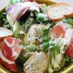 Caesar salad with Prosciutto and warm egg