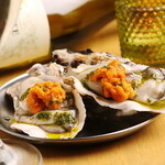 Raw Oyster topped with sea urchin