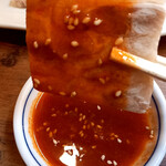 岡本 - ソフト豚足に味噌ダレを付けて