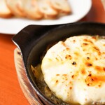 Oven-baked whole camembert cheese