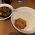 ジンコック - 料理写真:カニクリームコロッケの乗ったライス皿とカレー