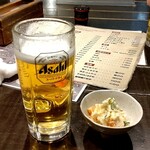 花しずく - お通し300円と生ビール550円。