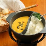 Cheese fondue with half and half baguette to choose from