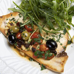 Sicilian sautéed swordfish (cherry tomatoes, pine nuts, oregano, olives, raisins)