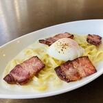 Carbonara with warm egg and bacon